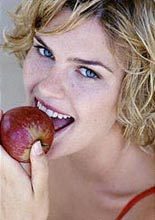 young-woman-eating-a-red-apple-4